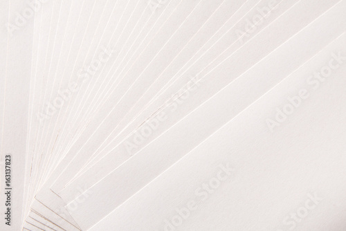 Paper sheets stack close up, abstract background