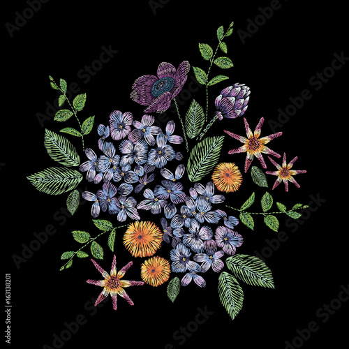 Embroidered composition with branch of lilac, flowers and leaves. Satin stitch embroidery floral design on black background. Folk line trendy pattern for clothes, dress, fabric, decor.