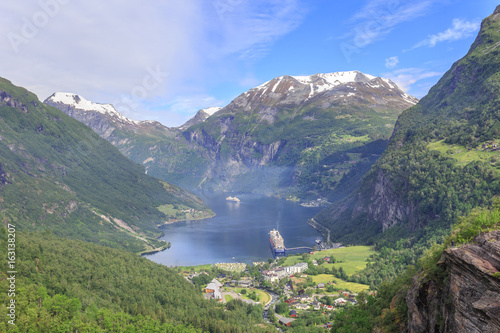 View of Geiranger fjord and Geiranger village and Eagle Road. It is a 15 km long branch of Sunnylvsfjorden, which is a branch of Storfjorden, it was listed as a UNESCO World Heritage Site 