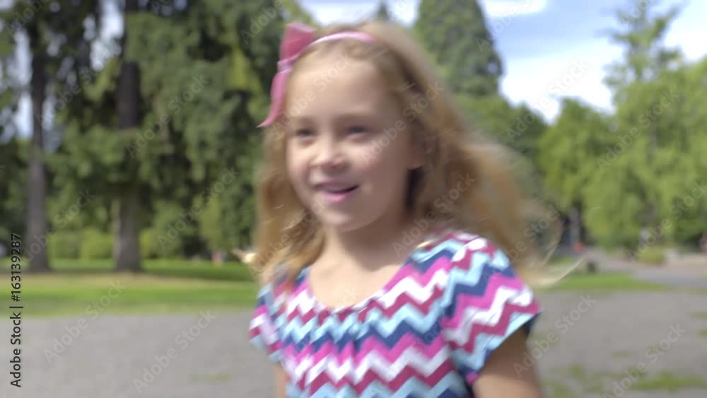 Cute Little Girl Walks In Park, She Gets Excited, Filled With Wonder And Curiosity, Runs To Duck Pond Cute Little Girl Walks In Park, She Gets Excited, Filled With Wonder And Curiosity, Runs To Duck Pond