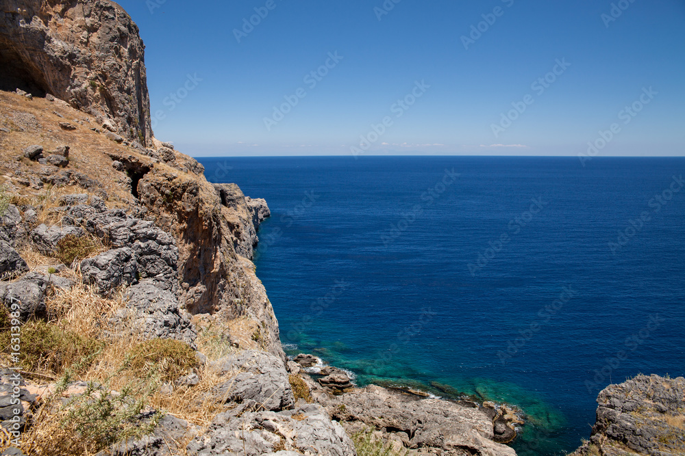 Bay and shore of the city of lindos. Blue water and wonderful beaches of Rhodes island. Bay and shore of the city of lindos. Blue water and wonderful beaches of Rhodes island.