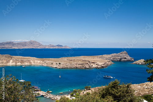 Bay and shore of the city of lindos. Blue water and wonderful beaches of Rhodes island. photo