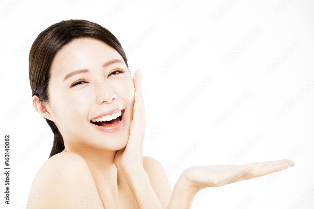 happy Beauty woman showing beauty product on her hand happy Beauty woman showing beauty product on her hand