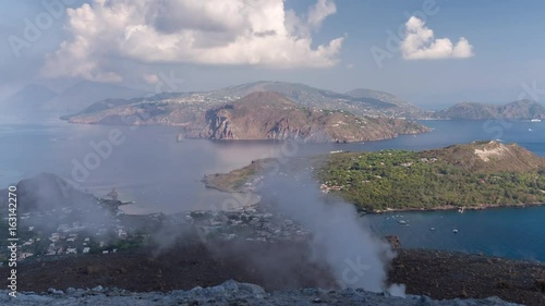 The incredible vulcano island off the coast of Sicily, Italy. vulcano has constant sulphurous fumes coming up through its vents in the crator photo