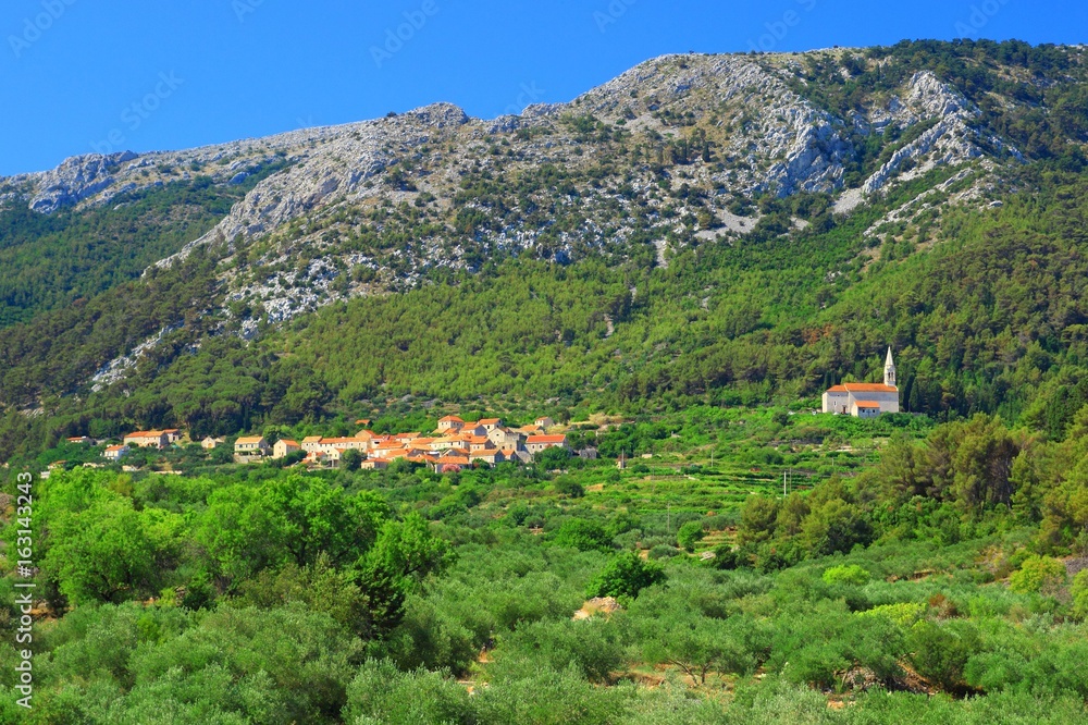 Picturesque village with old stoned houses and dislocated church, Pitve, Island Hvar, Croatia