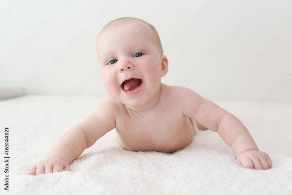 Happy smiling 4 months baby in diaper at home Happy smiling 4 months baby in diaper at home