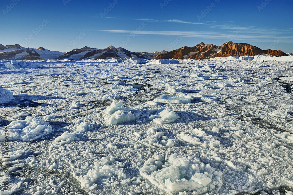 iceberg floating in greenland fjord iceberg floating in greenland fjord