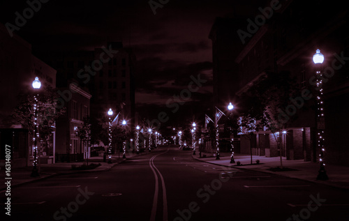 Glowing Downtown Street At Night