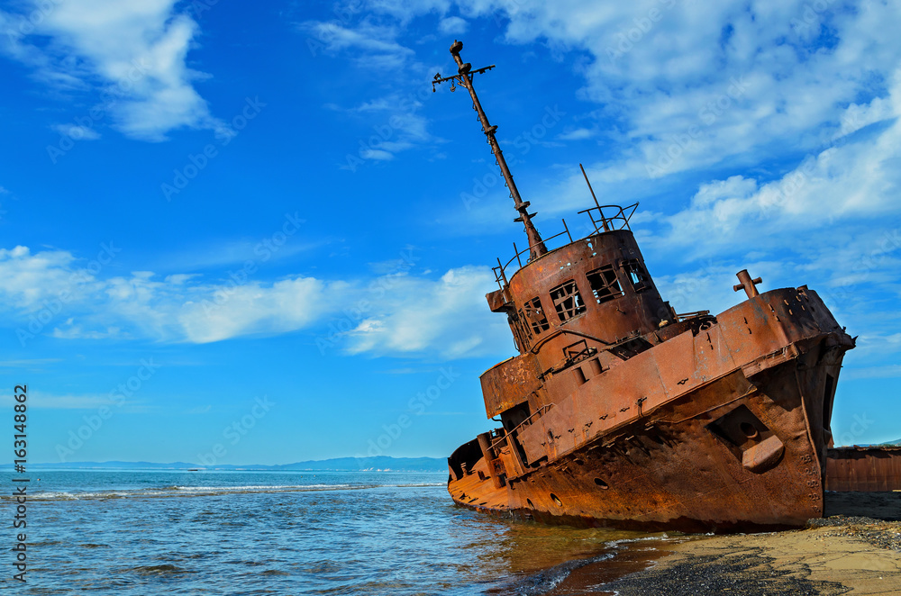 An old broken rusty ship