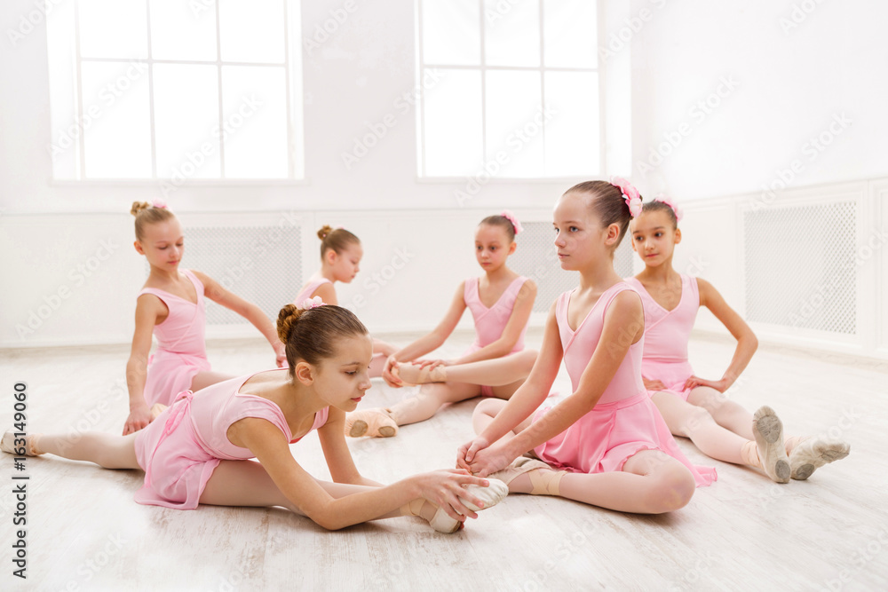 Fototapeta premium Little girls dancing ballet in studio