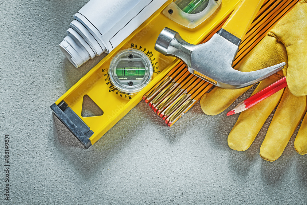 Collection of construction tools on concrete background building