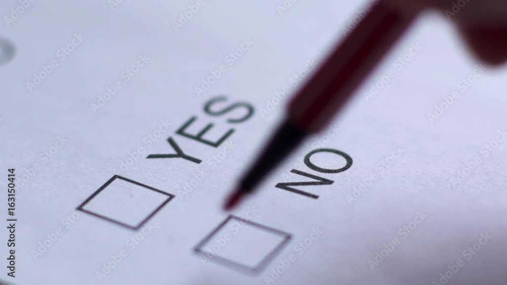 Cropped of businessman writing on checklist Cropped of businessman writing on checklist