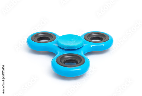 Blue spinner stress relieving toy isolated on white background