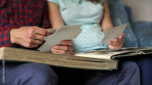 Happy family looking at a photo album