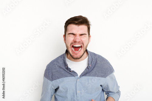 Portrait of angry crying man, isolated