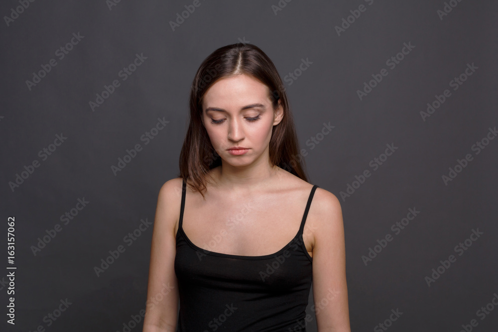 Sad woman looking down portrait Sad woman looking down portrait