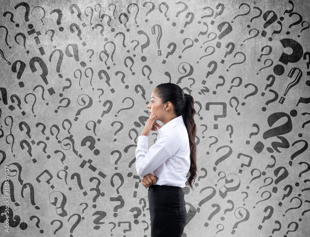 Confused businesswoman looking for solution Confused businesswoman looking for solution