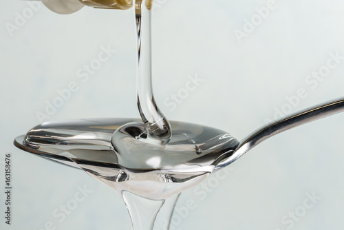 Pouring Light Corn Syrup on a Spoon