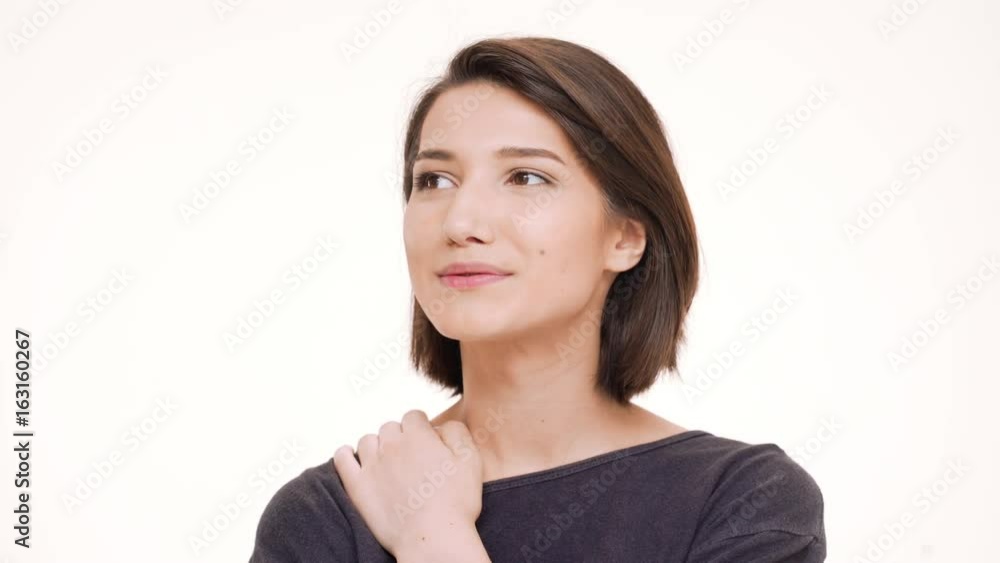 Portrait of young pretty girl smiling. White background Portrait of young pretty girl smiling. White background