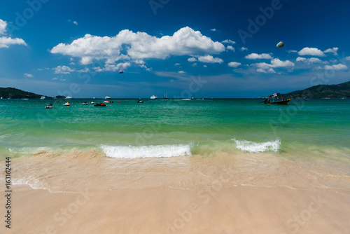 Fototapeta Naklejka Na Ścianę i Meble -  Beautiful bright sea and water splash at the tropical beach, Located Patong Beach Phuket Province, Thailand