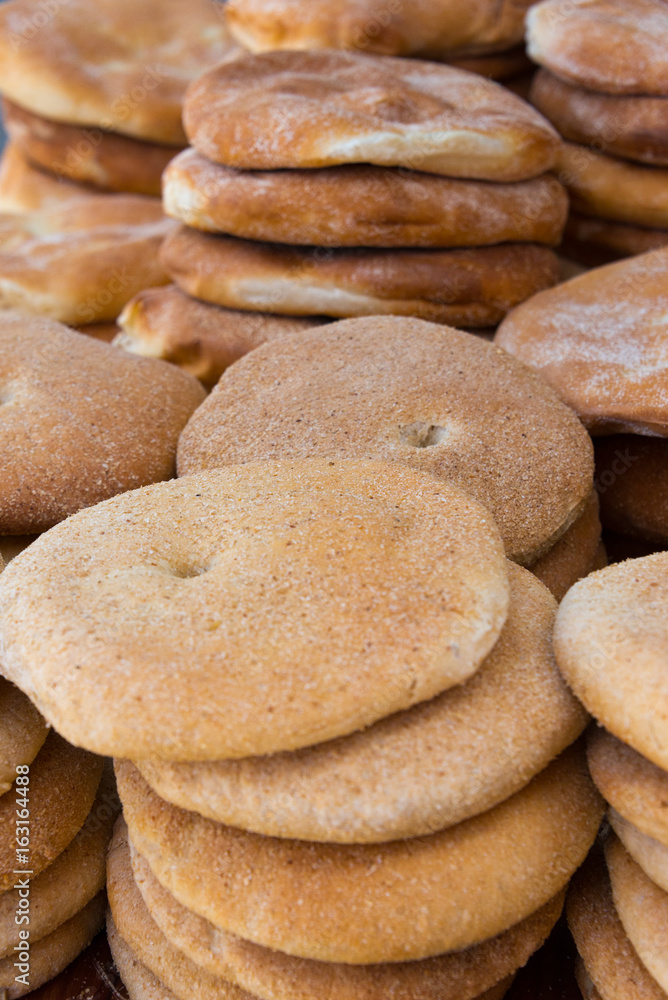 loafs of traditionsl khobz bread in bakery in morocco