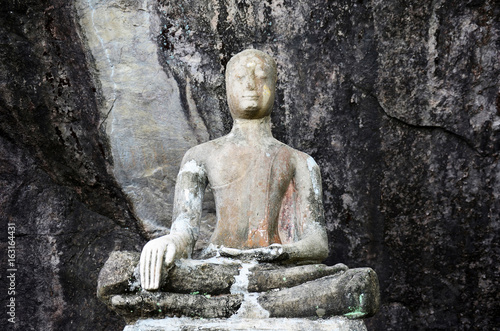 Old broken and ruin buddha statue at Wat Phra Phutthachai in Saraburi  Thailand