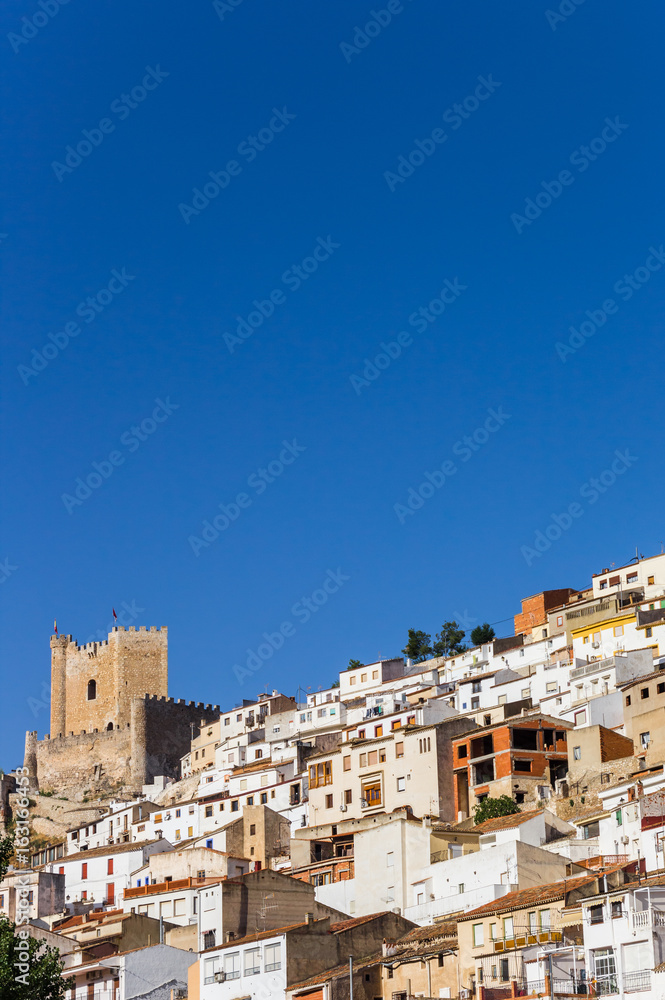 White houses and castle tower of Alcala del Jucar