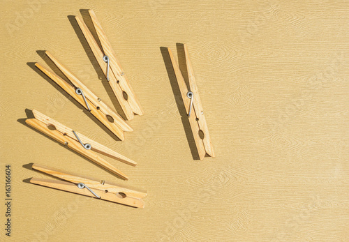Clothespins on a light brown background