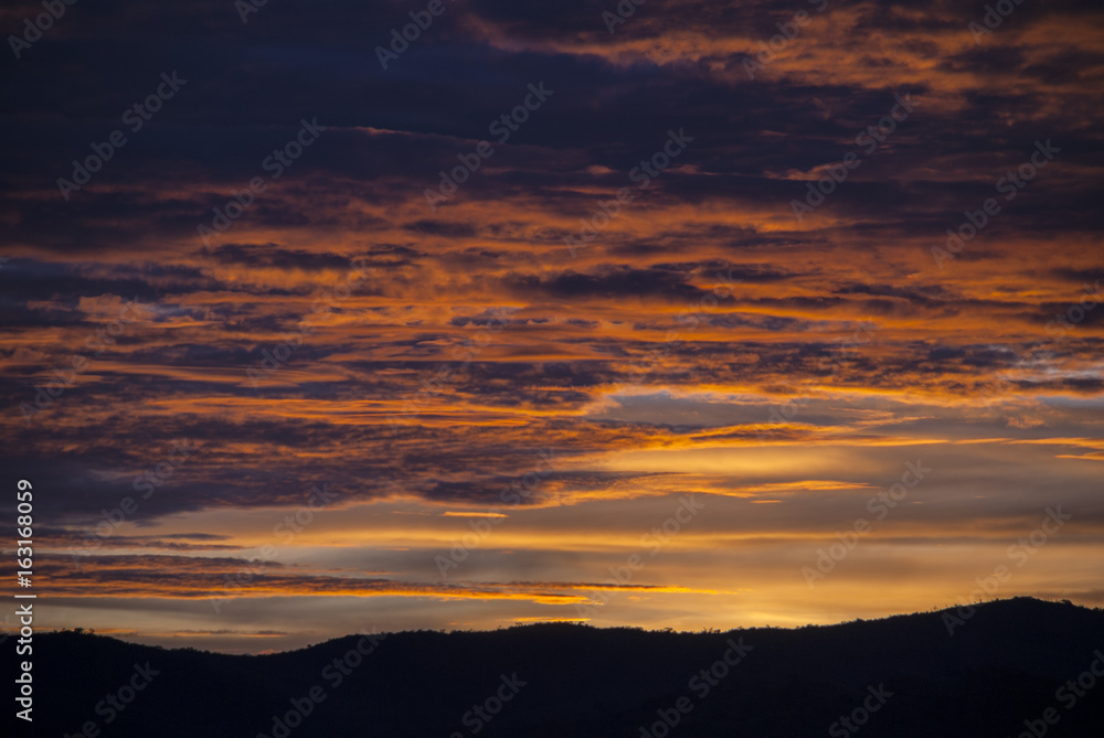Sunrise clouds and mountains in Guatemala, dramatic sky with striking colors.