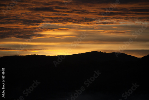 Sunrise clouds and mountains in Guatemala, dramatic sky with striking colors.