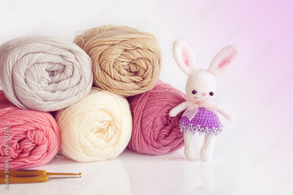 Handmade crochet doll. Cute rabbit doll on white background. Handmade crochet doll. Cute rabbit doll on white background.