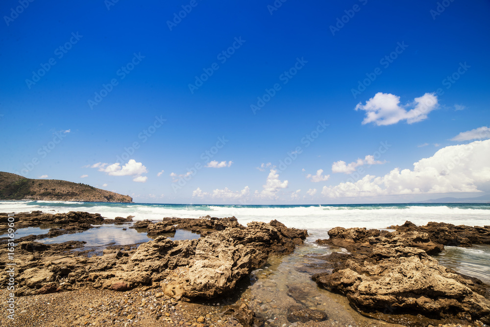 Rock beach in south italy with rough sea