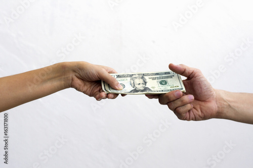 close up of hand giving money dollar note  