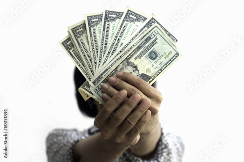 close up of hands holding dolla note on white background photo