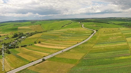 Aerial view of the sown fields near the motorway photo