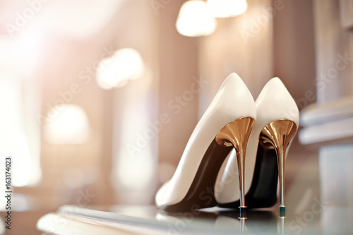 Canvas Print beautiful shoes for the bride on a high steel heels