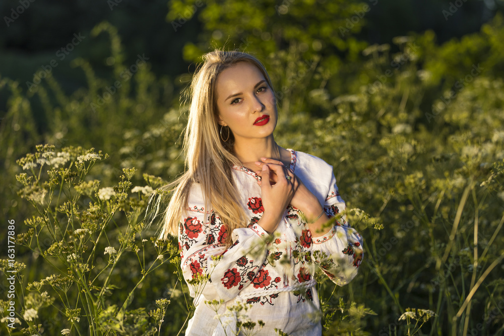 Young woman wearing Ukrainian Vyshyvanka blouse Young woman wearing Ukrainian Vyshyvanka blouse