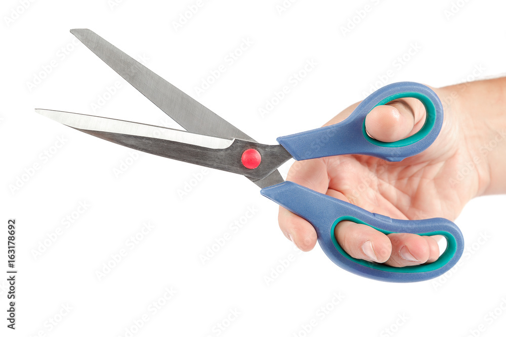 Stationery scissors in hand on white background. Stationery scissors in hand on white background.