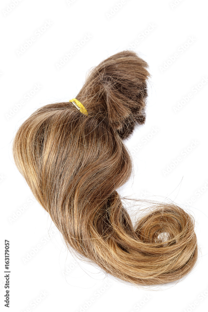 Curl of blond hair on a white background. Curl of blond hair on a white background.