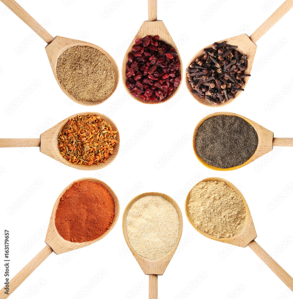 Collage of different seasoning in wooden spoon Collage of different seasoning in wooden spoon