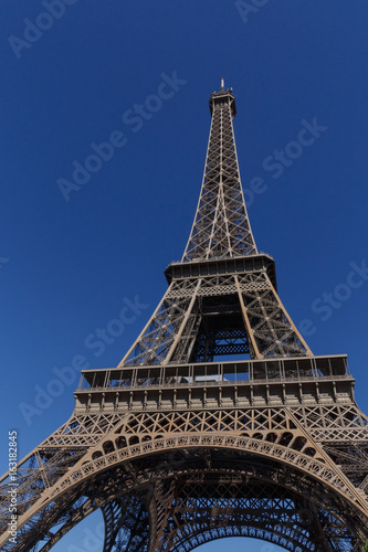 Eiffel tower in Paris against blue sky © romantiche
