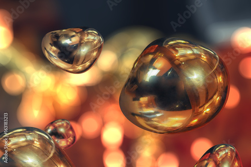 Gold bubbles in zero gravity, macro. Fluid in weightlessness.