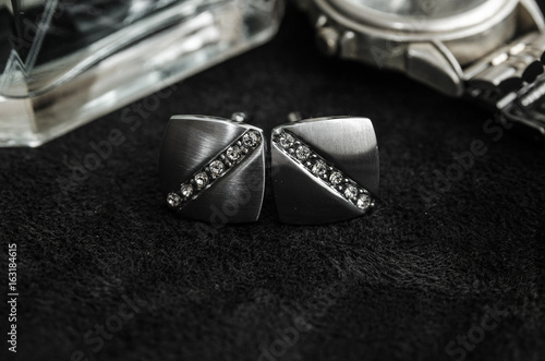 Silver cufflinks, black and white photo