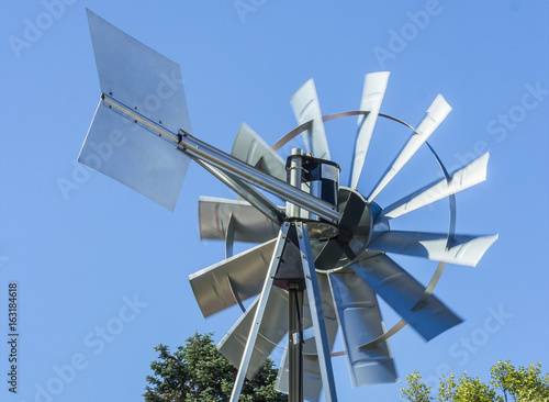 Close up of Wind turbine producing alternative energy. blue sky