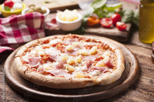 Wood Fired Gourmet pizza with a topping of Ham and Pineapple