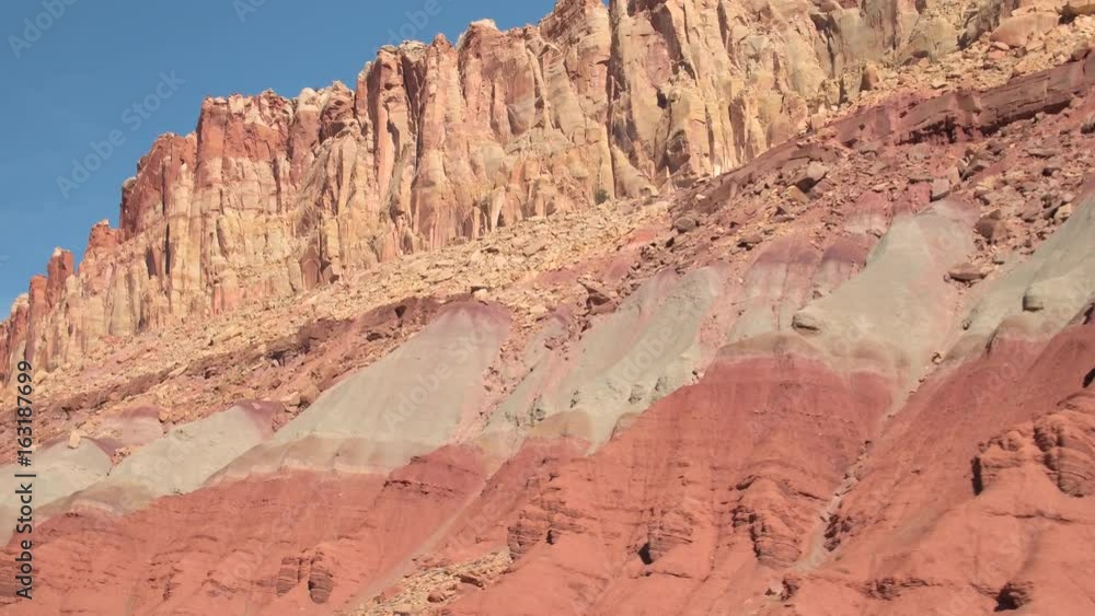 CLOSE UP: Driving past big eroded rocky mountains in red rock desert on hot summer day. Driving past the rocky mountain formations in Utah, United states. Dry desert landscape in sunny Capitol Reef CLOSE UP: Driving past big eroded rocky mountains in red rock desert on hot summer day. Driving past the rocky mountain formations in Utah, United states. Dry desert landscape in sunny Capitol Reef