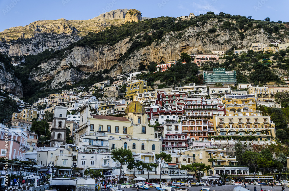 Positano and the dome of the church of Santa Maria Assunta with its colorful tiles.