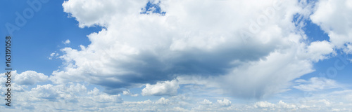 Sunny blue sky background with clouds Panorama Photo