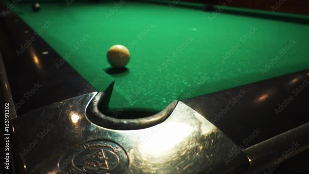 Pool Table Breaking Playing billiards, blowing a cue on the ball, the ball hit the pocket ...