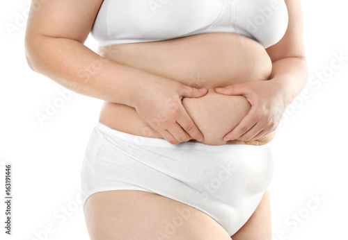 Wallpaper Mural Overweight young woman in underwear on white background. Diet concept Torontodigital.ca